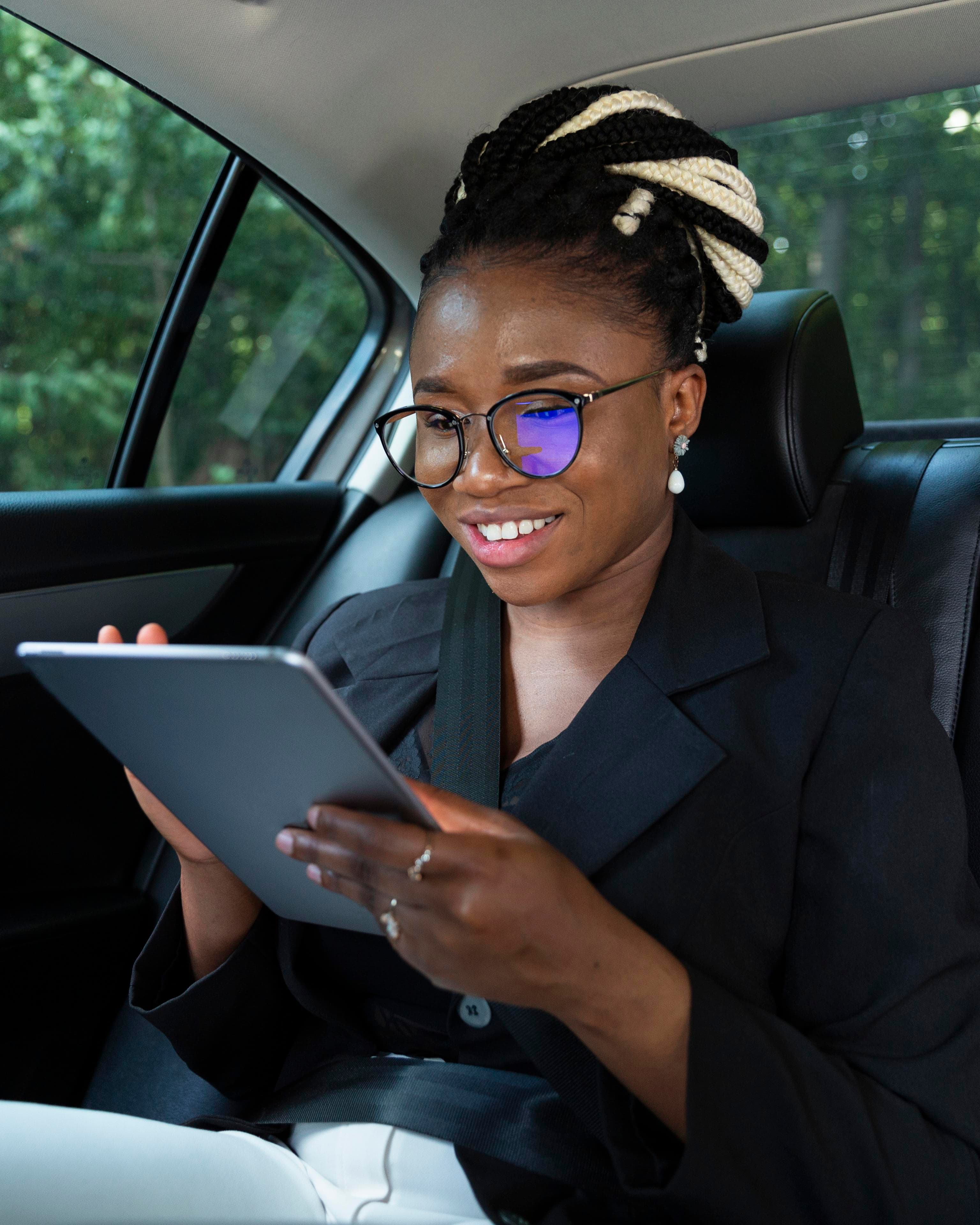 Passenger working on tablet during a ride